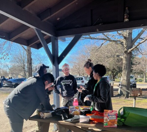 VA LCV member Colin works with volunteers in a park
