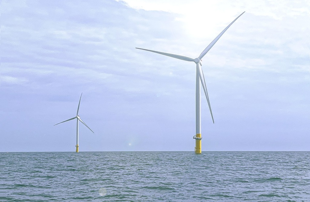 Two offshore wind turbines.