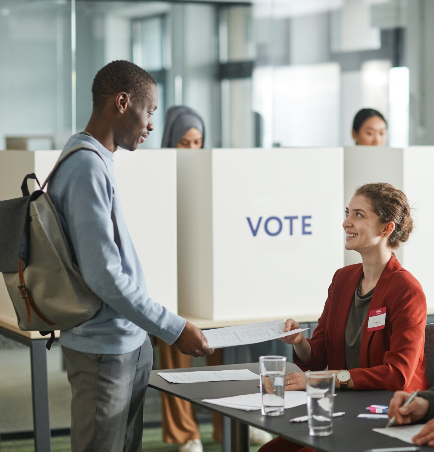 A man checks in to vote at a polling station