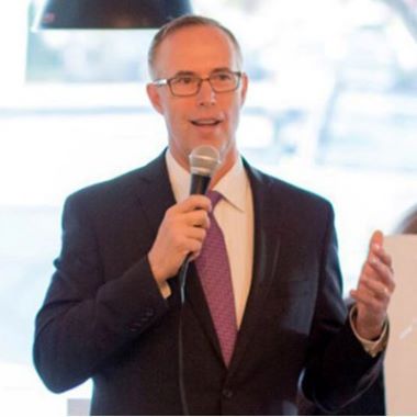 Representative Jared Huffman speaks into a microphone.