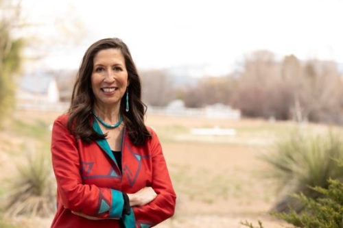 Portrait of Representative Teresa Leger Fernandez standing outside.