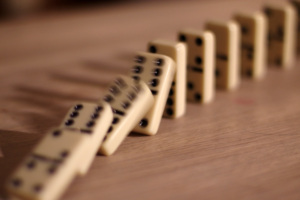 A line of falling dominoes.