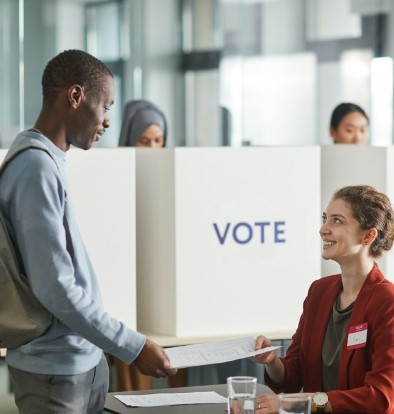 A man checks in to vote at a polling station.