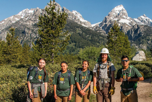 Montana Climate Corps Volunteers standing for a picture in front of a mountain range.