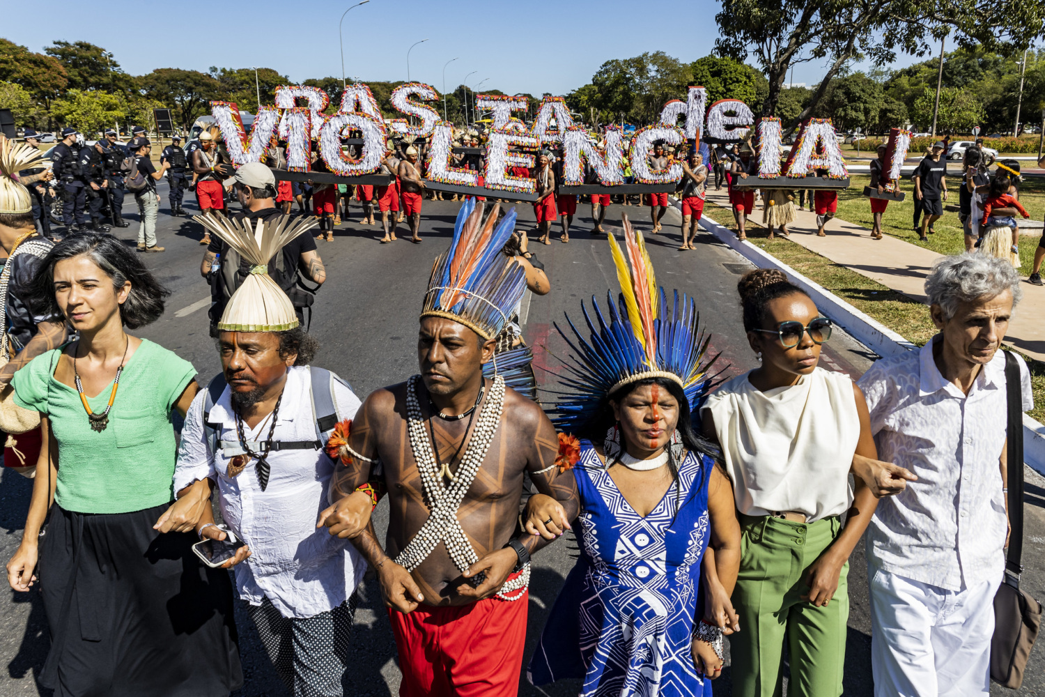 A group of Indigenous Brazilian people marching.