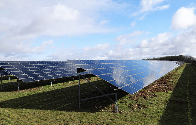 Rows of solar panels in a field in Burgandy, France.