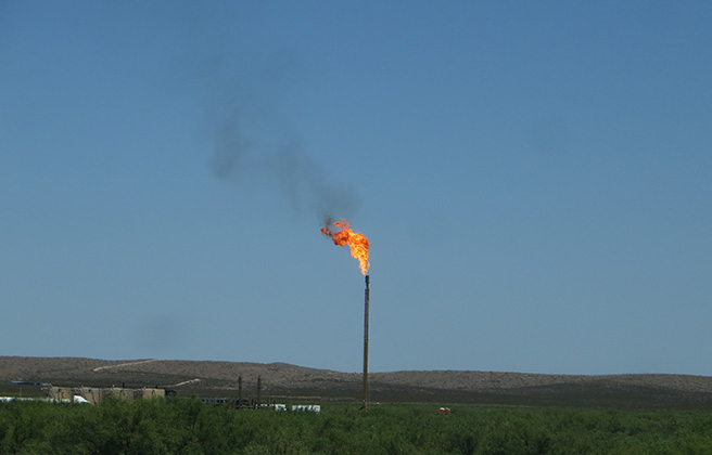 A single methane flare of fire.