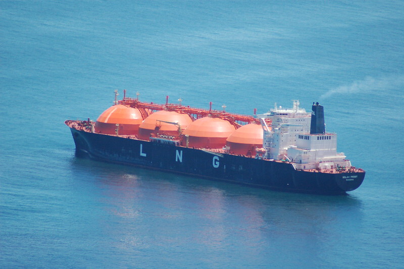 View from above of a Liquified Natural Gas transport ship in the ocean.