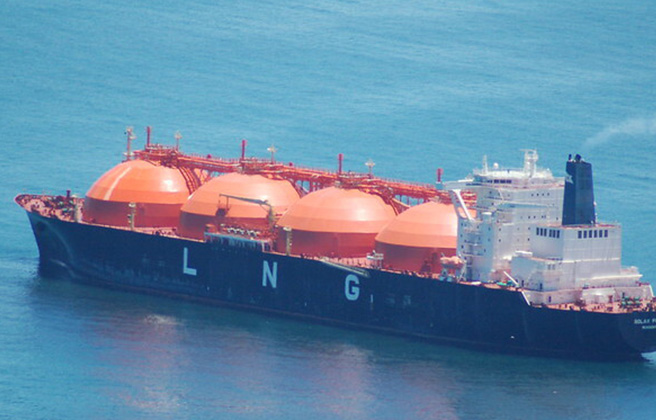 View from above of a Liquified Natural Gas transport ship in the ocean.