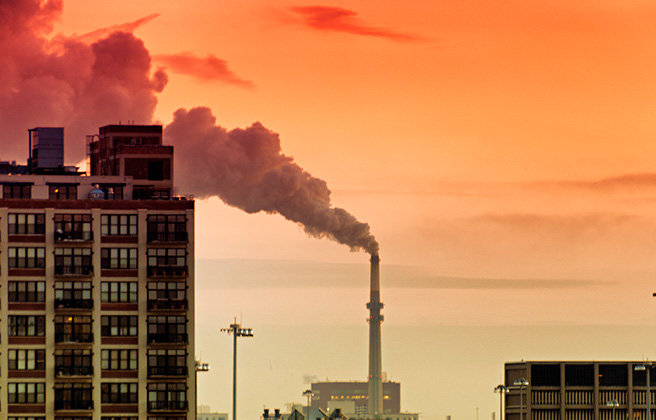 Fisk Generating Plant emitting pollution plumes of smoke into the air.