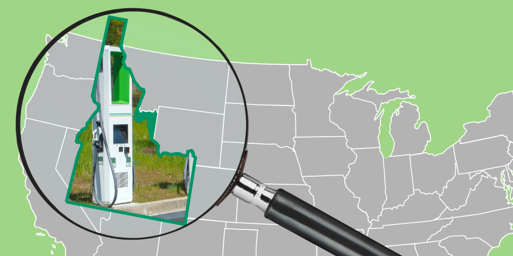 Map of the United States with Idaho magnified by a magnifying glass and showing electric vehicle charging station