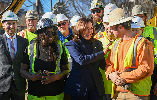 Vice President Kamala Harris stands with a Pittsburgh Water and Sewer Authority construction crew. 