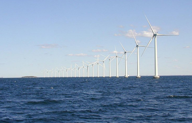 Wind turbines located offshore in the ocean.