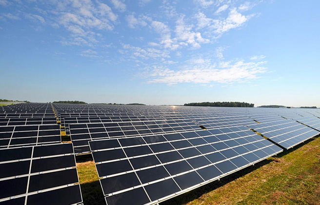 A row of solar panels at a solar facility.