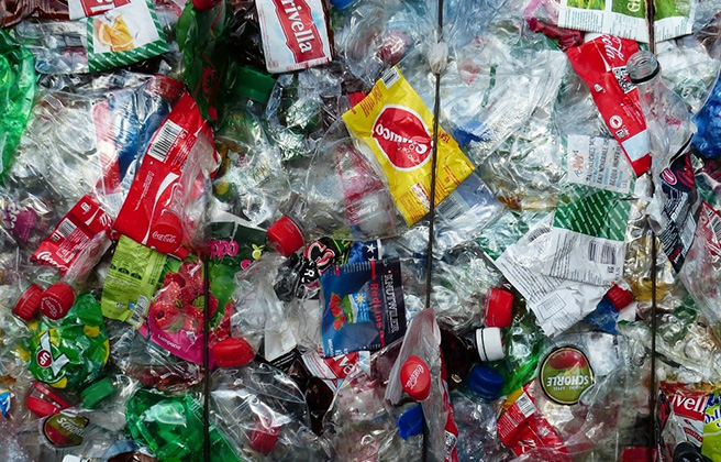 Closeup of a mass of plastic waste in landfill.