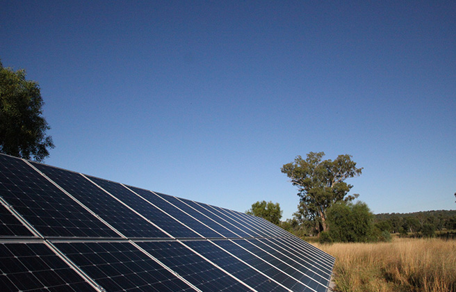 Solar panels set in front of a blue sky in Maules Creek.