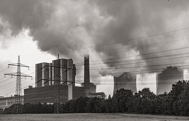 Coal power plant emitting pollution smoke.