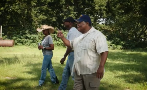 Three Georgia farmers walking in the field