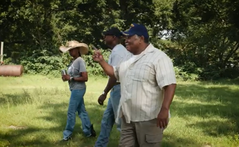 Three Georgia farmers walking in the field