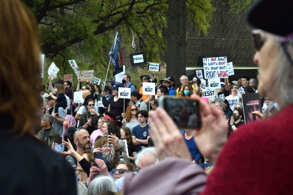 Protesters carrying signs line the streets in Washington D.C.