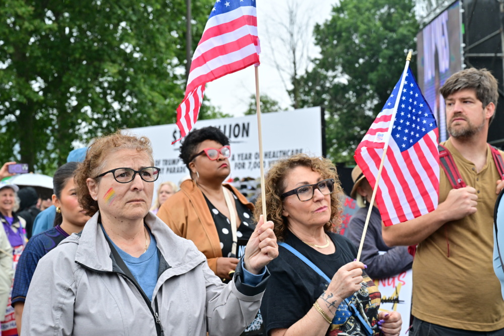 Protesters carrying American flags.