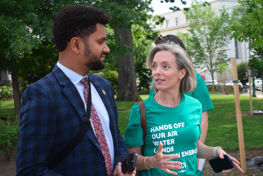 Rep. Maxwell Frost and Sarah Chieffo talking outside of the U.S. Capitol building.