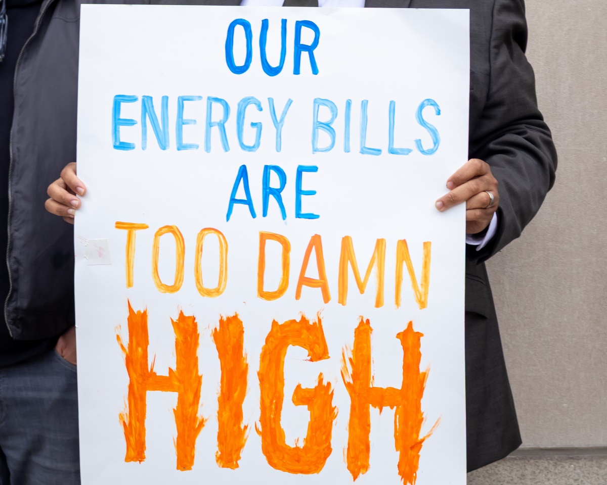 A sign that reads "Our energy bills are too damn high."