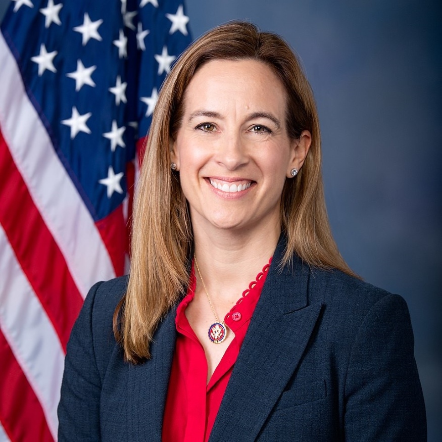 Mikie Sherrill in front of an American flag.