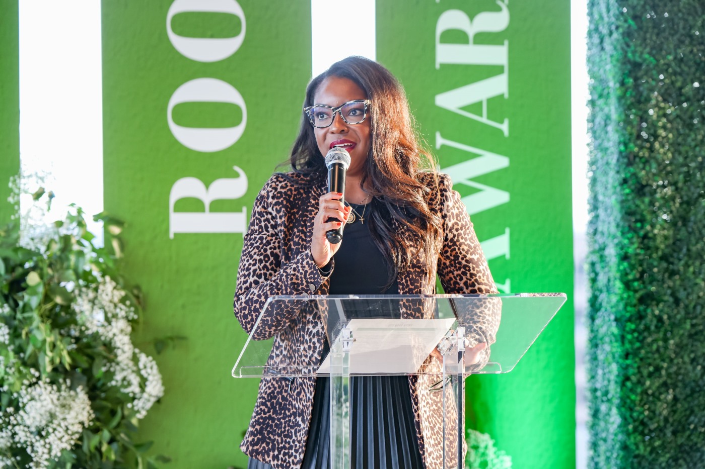 Rep. Sykes speaks at a podium.