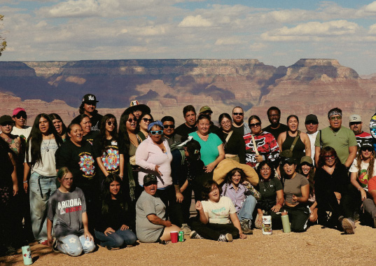 Community members pose for a photo at the Grand Canyon