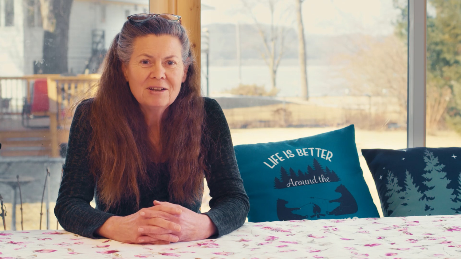 Lee Donahue sits at her kitchen table