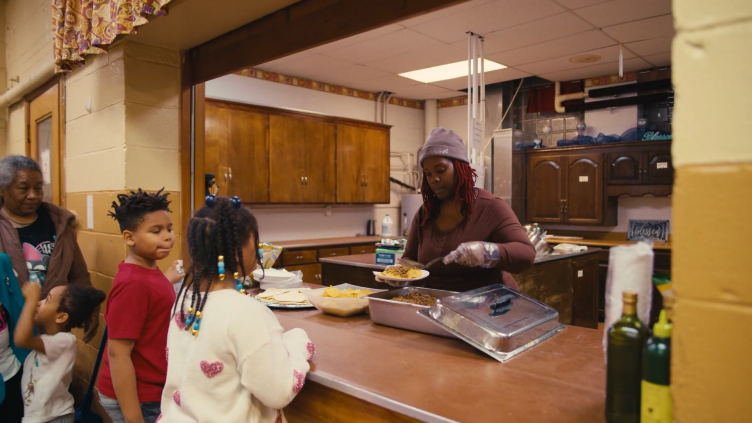 Shy McElroy serves food