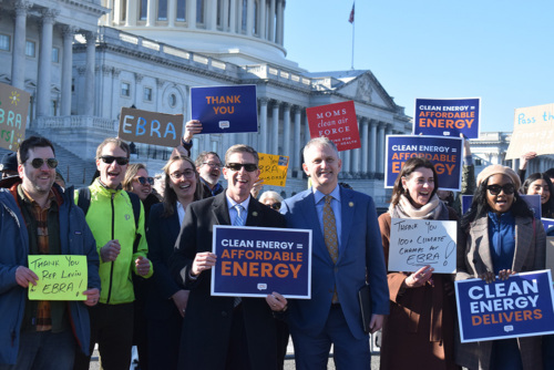 Representatives Mike Levin and Sean Casten with a group of advocates outside the U.S. Capitol building.